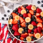 4th of July Fruit Salad with strawberries blueberries and bananas in a bowl