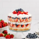4th of July Trifle layered with strawberries, blueberries, cake, and cream