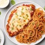 Crispy baked chicken parmesan with marinara and melted mozzarella