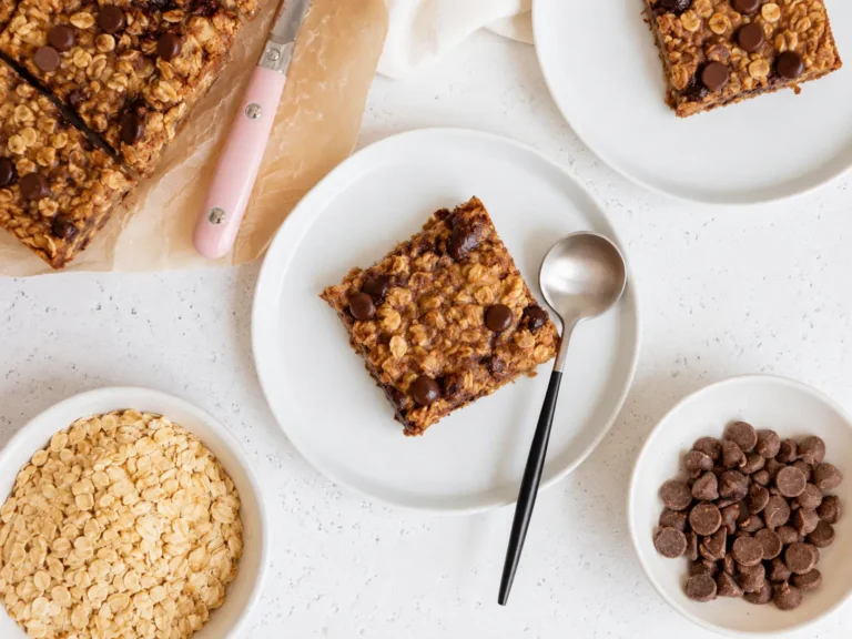Freshly baked Banana Oatmeal Bars with chocolate chips on a cooling rack
