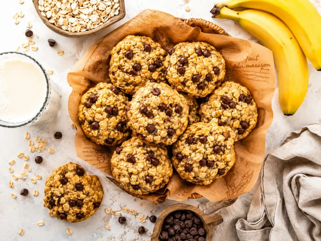 Freshly baked Banana Oatmeal Chocolate Chip cookies on a cooling rack