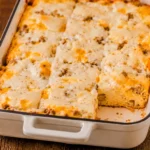 Biscuits and Gravy breakfast casserole baked with sausage and cheddar cheese