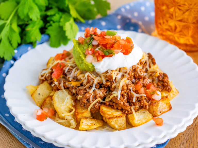 Cheesy Taco Potatoes topped with taco beef and melted cheese
