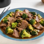 Chinese Beef and Broccoli served over rice with glossy savory sauce