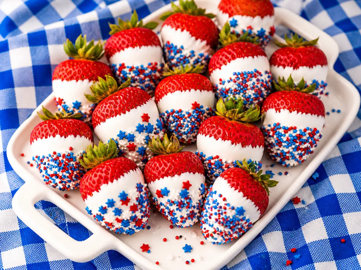 Chocolate Covered Strawberries that are irresistibly easy and fun to make decorated with red white and blue sprinkles