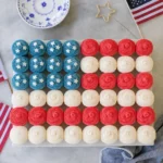 Easy Flag Cupcake with strawberries and blueberries arranged like a flag