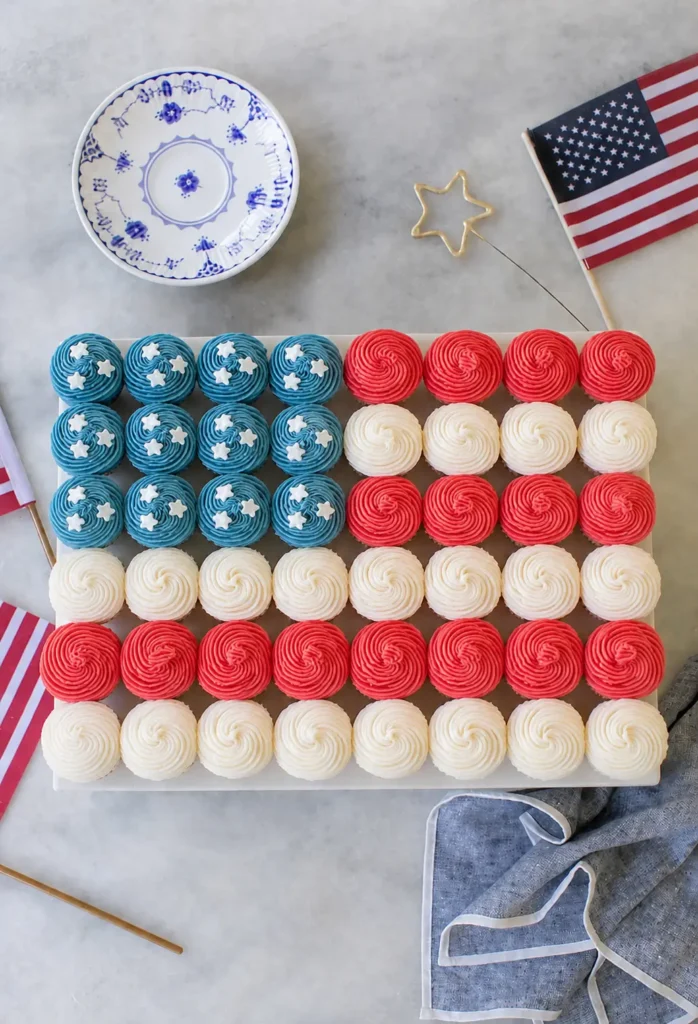 Easy Flag Cupcake with strawberries and blueberries arranged like a flag
