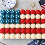 Easy Flag Cupcake with strawberries and blueberries arranged like a flag