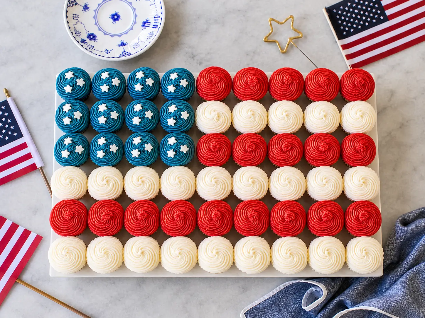 Easy Flag Cupcake with strawberries and blueberries arranged like a flag