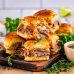 French Dip Sliders with roast beef, melted provolone, and au jus