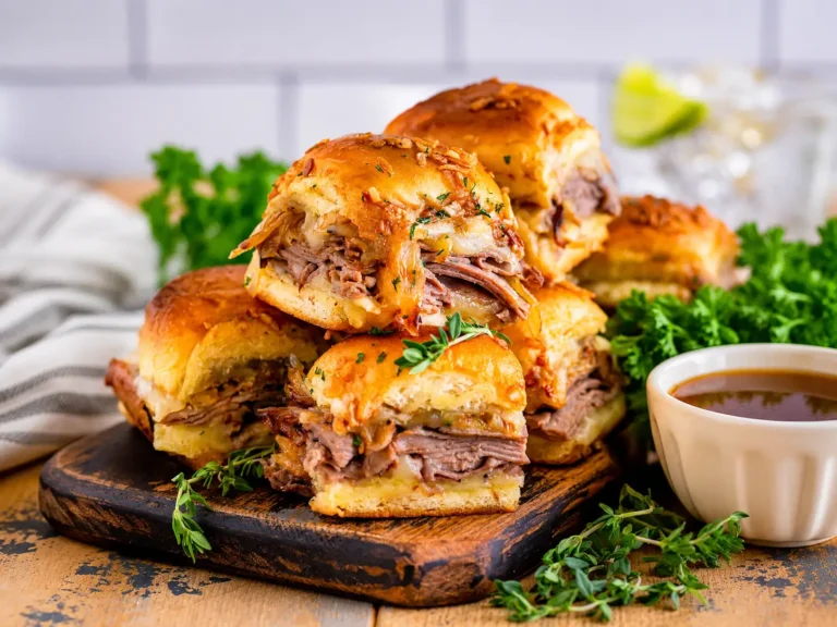 French Dip Sliders with roast beef, melted provolone, and au jus
