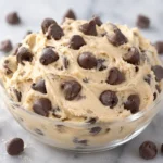Creamy Greek Yogurt Cookie Dough topped with chocolate chips in a bowl
