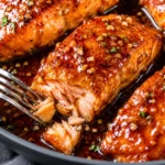 Honey Garlic Salmon served with glossy glaze and fresh lemon