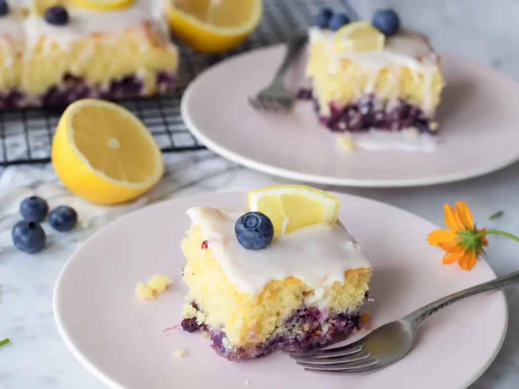 Lemon Blueberry Sheet Cake topped with fresh lemon glaze and blueberries