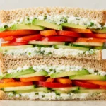 Cucumber Avocado Sandwich with avocado, cucumber, and creamy cheese spread on toasted whole-wheat bread