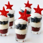 Red, White and Blue No-Bake Cheesecake parfaits with blueberries and whipped cream