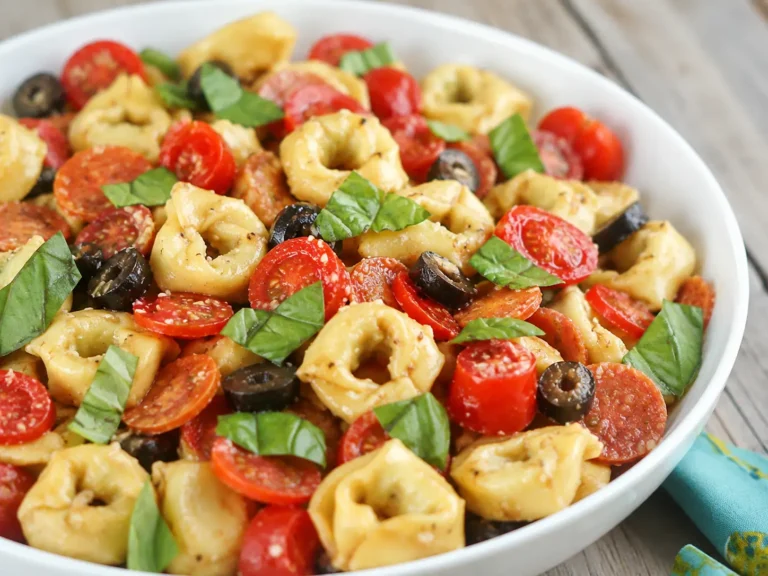 Roasted Red Pepper Tortellini Salad served cold with basil and parmesan