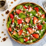 Spinach & Strawberry Meal-Prep Salad with chicken, feta, and walnuts in meal-prep containers