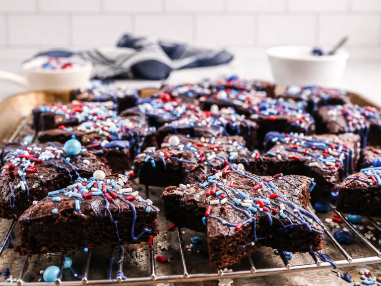 Star-Spangled Brownies topped with blue candy drizzle and patriotic sprinkles
