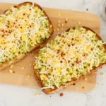 Avocado Toast with Egg on crispy sourdough with hot honey